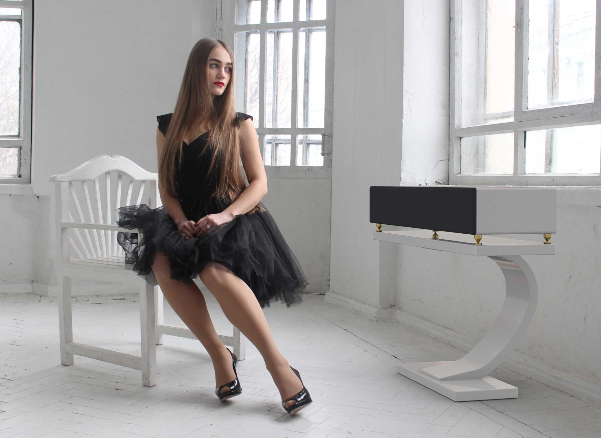 bass clef speaker in room with woman